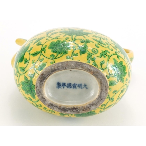 342 - Chinese porcelain yellow ground wine ewer, hand painted with flower heads amongst foliate scrolls, s... 