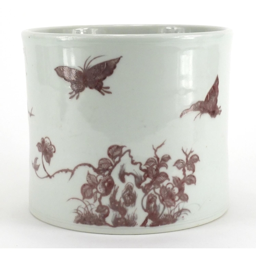 343 - Chinese porcelain cylindrical brush pot, hand painted in iron red with butterflies amongst flowers, ... 