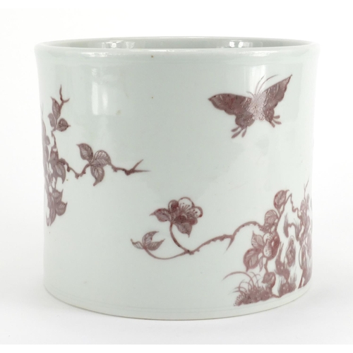 343 - Chinese porcelain cylindrical brush pot, hand painted in iron red with butterflies amongst flowers, ... 