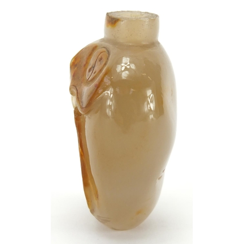 387 - Chinese agate snuff bottle carved with a mythical animal, 5.1cm high