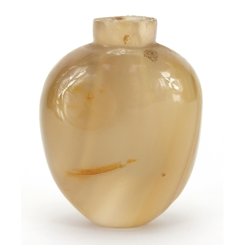 387 - Chinese agate snuff bottle carved with a mythical animal, 5.1cm high