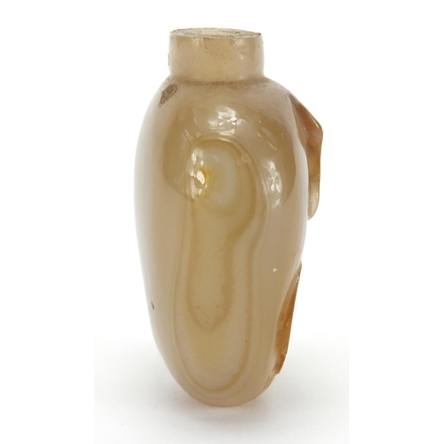 387 - Chinese agate snuff bottle carved with a mythical animal, 5.1cm high