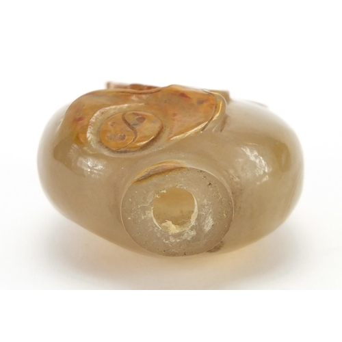 387 - Chinese agate snuff bottle carved with a mythical animal, 5.1cm high