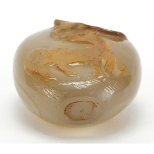 387 - Chinese agate snuff bottle carved with a mythical animal, 5.1cm high