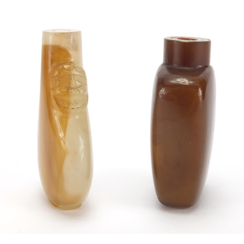 388 - Two Chinese hardstone snuff bottles, one with animalia handles the other carved with a Daoist emblem... 