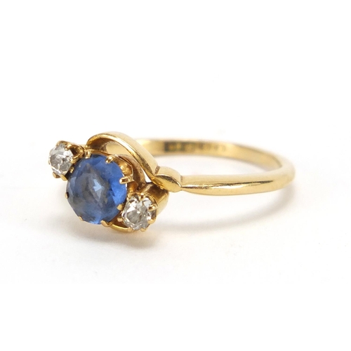 735 - 18ct gold blue stone and diamond crossover ring, size P, approximate weight 3.4g