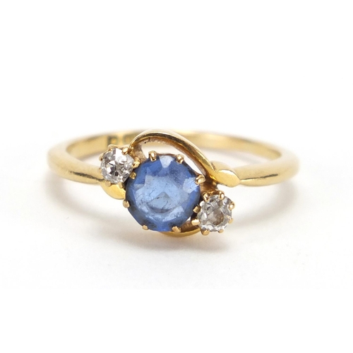 735 - 18ct gold blue stone and diamond crossover ring, size P, approximate weight 3.4g