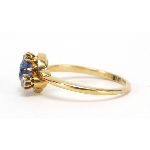 735 - 18ct gold blue stone and diamond crossover ring, size P, approximate weight 3.4g