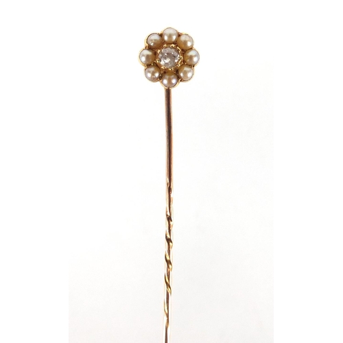 750 - Unmarked diamond and seed pearl tie pin, housed in a Junghans tooled leather box, 7cm in length, app... 