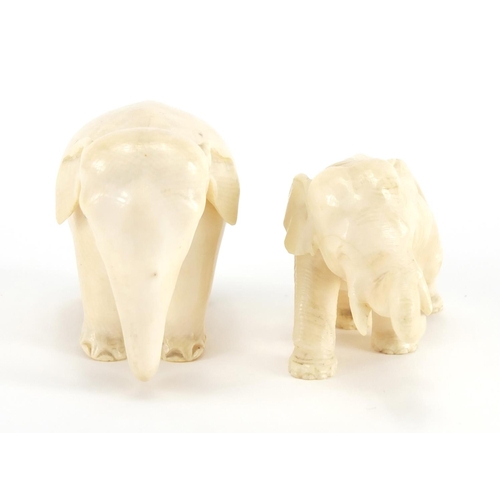 414 - Two carved ivory elephants including a Japanese example with character marks to the base of one foot... 