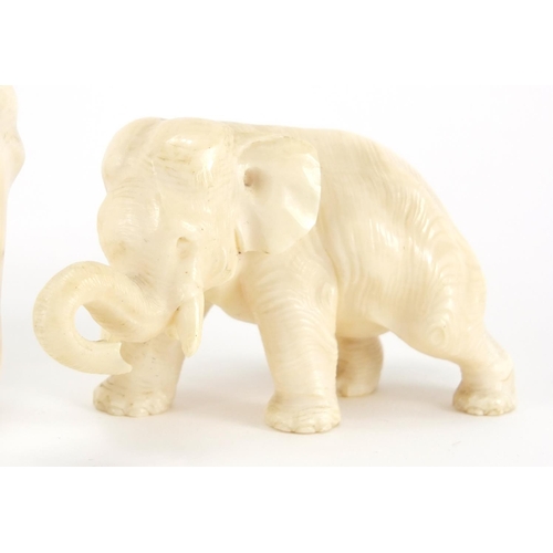 414 - Two carved ivory elephants including a Japanese example with character marks to the base of one foot... 