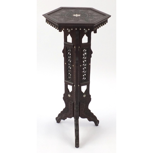 481 - Middle Eastern hardwood stand, with hexagonal top and Mashrabiya panels, carved with foliate motifs,... 