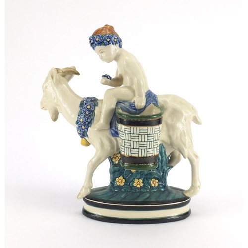 557 - Continental porcelain figure of a young boy on a goat, factory marks and numbered 1003 to the base, ... 