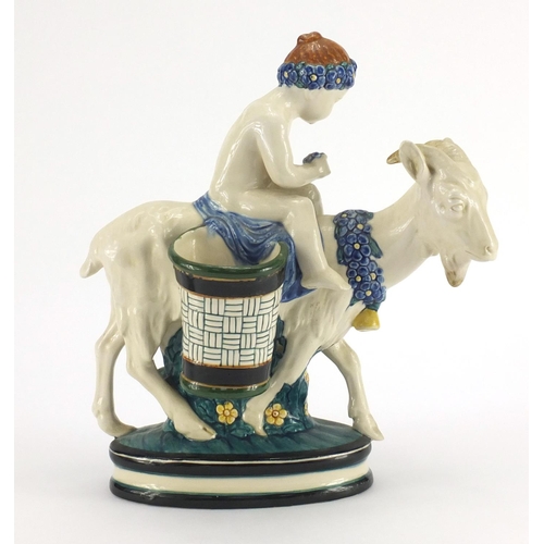 557 - Continental porcelain figure of a young boy on a goat, factory marks and numbered 1003 to the base, ... 