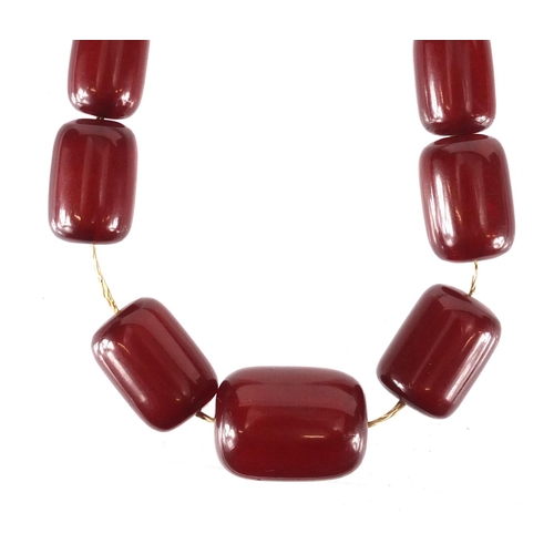 814 - Cherry amber coloured bead necklace, 44cm in length, approximate weight 60.0g