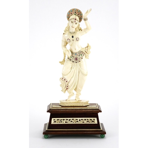 460 - ** DESCRIPTION AMENDED 10/1 ** Anglo-Indian carved ivory jewelled Goddess, raised on a carved rectan... 