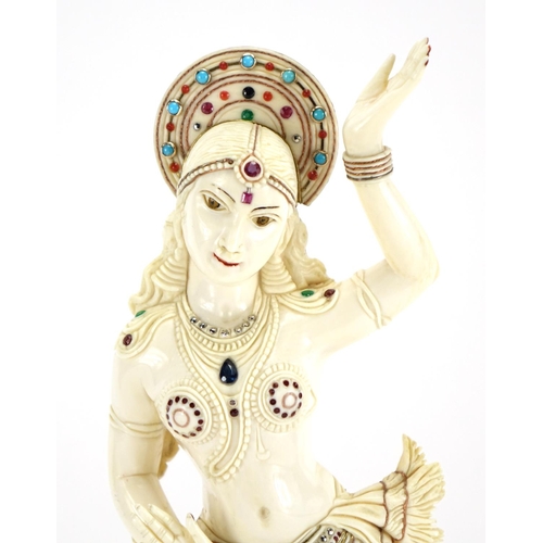 460 - ** DESCRIPTION AMENDED 10/1 ** Anglo-Indian carved ivory jewelled Goddess, raised on a carved rectan... 