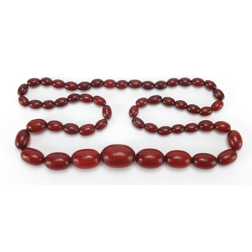 812 - Amber coloured bead necklace, 80cm in length