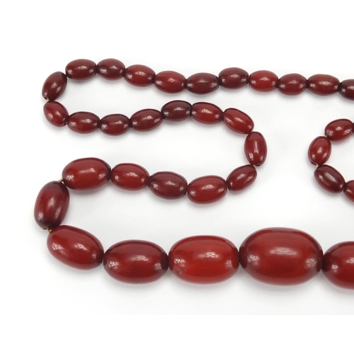 812 - Amber coloured bead necklace, 80cm in length