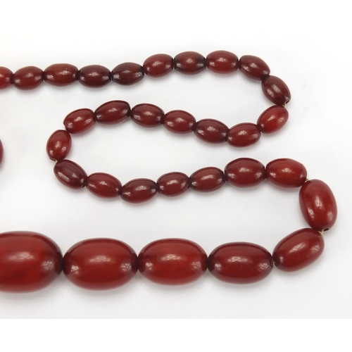 812 - Amber coloured bead necklace, 80cm in length