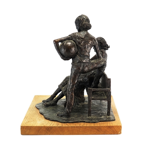 2113A - David Roper Curzon, patinated bronze study two figures by a bench, raised on a rectangular oak block... 