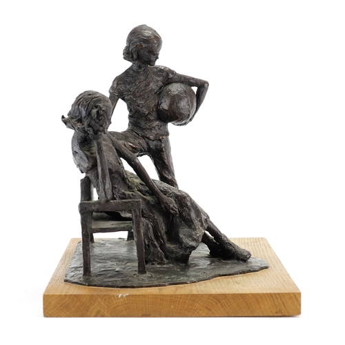 2113A - David Roper Curzon, patinated bronze study two figures by a bench, raised on a rectangular oak block... 