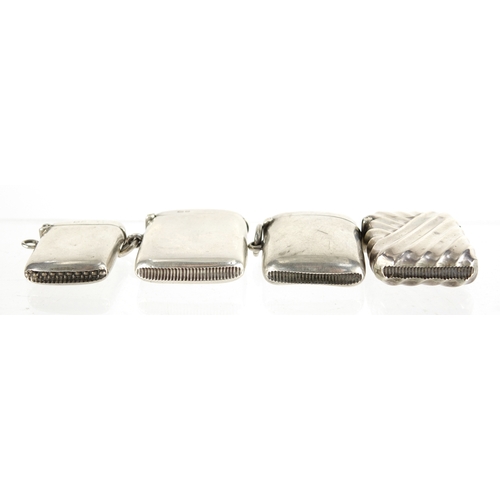 617 - Four rectangular silver vesta's, one with embossed decoration, Birmingham and Chester hallmarks, the... 