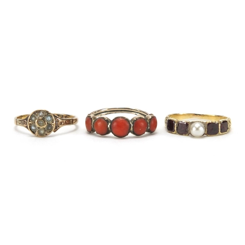 715 - Three antique gold rings including coral, seed pearl and garnet, various sizes, approximate weight 4... 