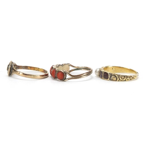 715 - Three antique gold rings including coral, seed pearl and garnet, various sizes, approximate weight 4... 