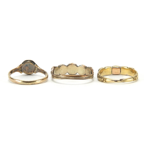 715 - Three antique gold rings including coral, seed pearl and garnet, various sizes, approximate weight 4... 