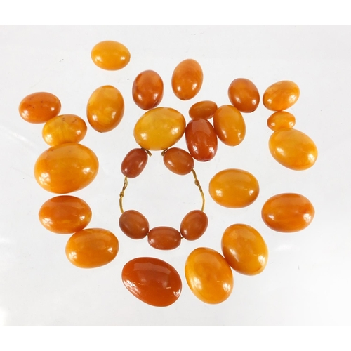 803 - Butterscotch amber coloured beads, the largest 2.5cm in length, approximate weight 68.0g