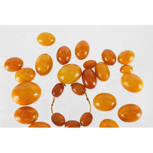 803 - Butterscotch amber coloured beads, the largest 2.5cm in length, approximate weight 68.0g