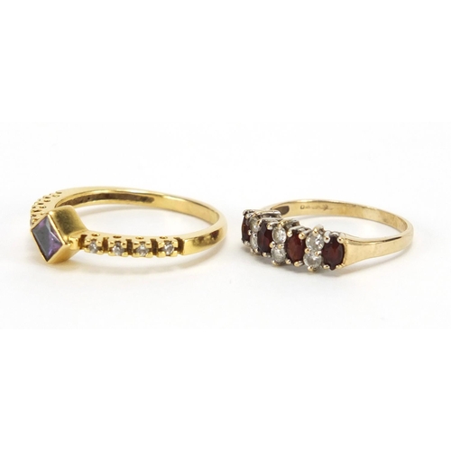 2445 - Two 9ct gold rings set with garnet and clear stones, sizes R and J, approximate weight 4.4g