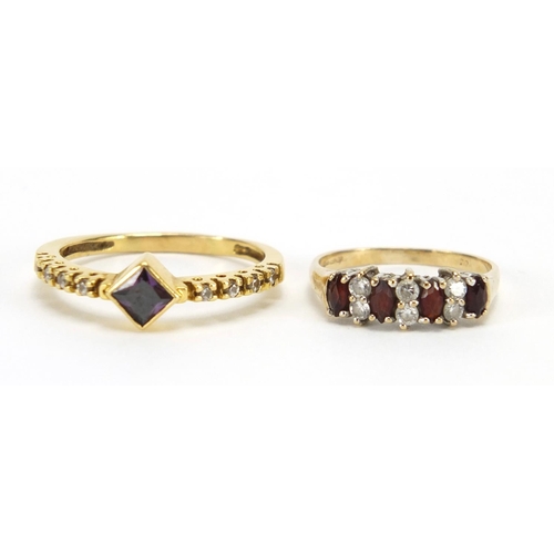 2445 - Two 9ct gold rings set with garnet and clear stones, sizes R and J, approximate weight 4.4g