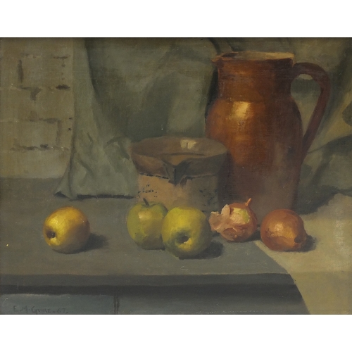 962 - Still life fruit and vessels, oil on canvas, bearing a signature E M Guire, mounted and framed, 48.5... 