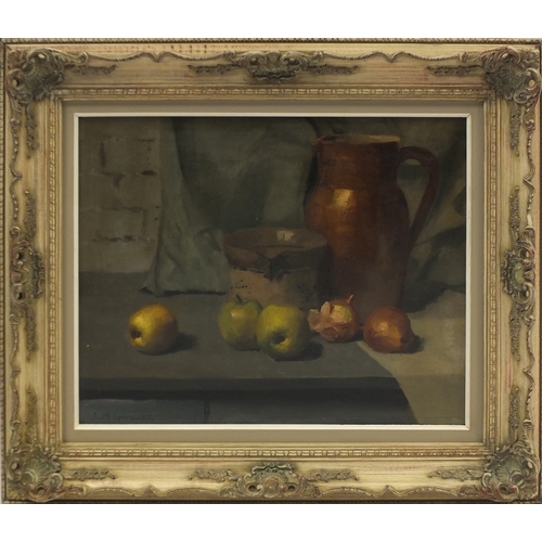 962 - Still life fruit and vessels, oil on canvas, bearing a signature E M Guire, mounted and framed, 48.5... 