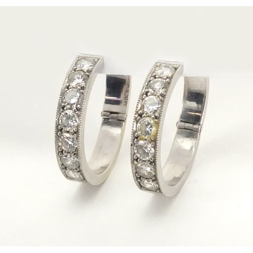 667 - Pair of unmarked white metal diamond hoop earrings, 2.4cm in diameter, approximate weight 8.3g