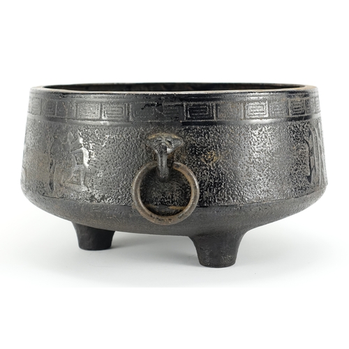 355 - Chinese iron tripod censer with twin ring turned handles, depicting character marks, 18cm high x 35c... 