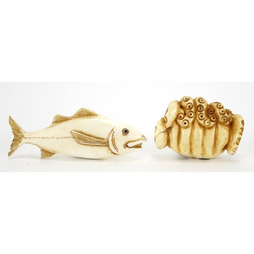 425 - Two Japanese carved ivory netsuke's of a fish and octopus, both signed, the largest 5.5cm wide