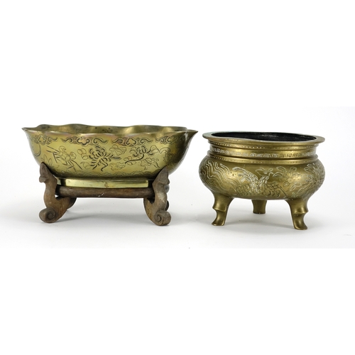 357 - Chinese bronze bowl raised on a hardwood stand, together with a three footed censer cast with phoeni... 