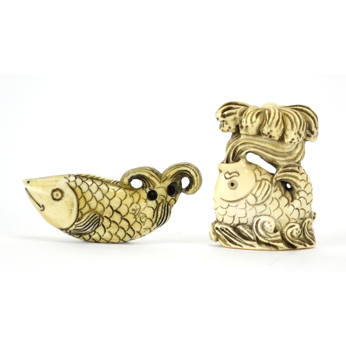 433 - ** WITHDRAWN FROM SALE ** Two Japanese carved ivory netsuke's of fish, both with character marks, th... 