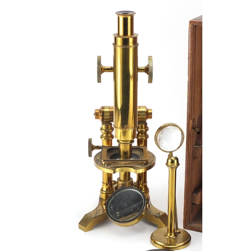 27 - 19th century brass microscope by Ross of London, numbered 5219 with lenses and fitted mahogany case