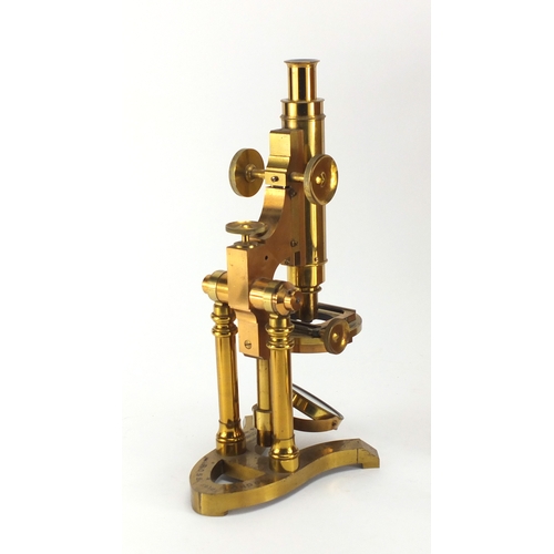 27 - 19th century brass microscope by Ross of London, numbered 5219 with lenses and fitted mahogany case