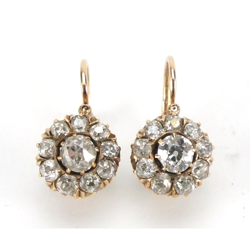 689 - Pair of Victorian 14ct gold diamond cluster earrings, each marked 585, 1.7cm in length, approximate ... 
