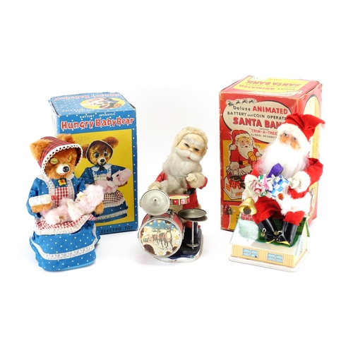 2180 - Three vintage tinplate toys, two with boxes including Hungry Baby Bear and Santa Bank