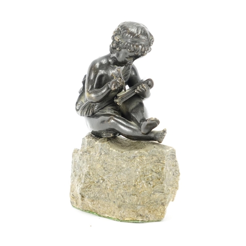 2141 - Patinated classical bronze model of a young boy, raised on a stone base, 16cm high