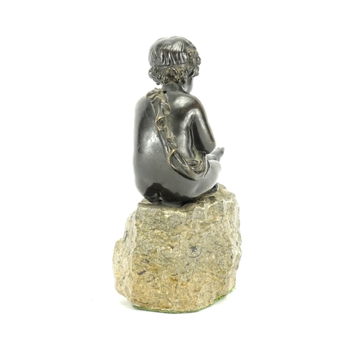 2141 - Patinated classical bronze model of a young boy, raised on a stone base, 16cm high