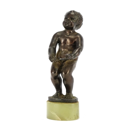 2283 - Art Deco style patinated bronze model of a nude young boy, raised on an oval green onyx base, 12cm h... 
