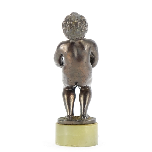 2283 - Art Deco style patinated bronze model of a nude young boy, raised on an oval green onyx base, 12cm h... 