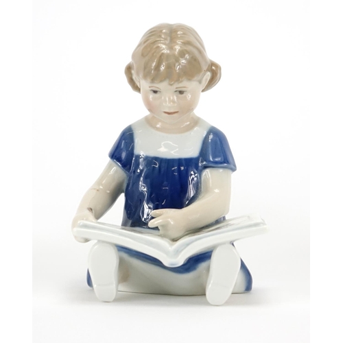 2100 - Three Royal Copenhagen figurines including one of a young girl reading a book and one of a young gir... 